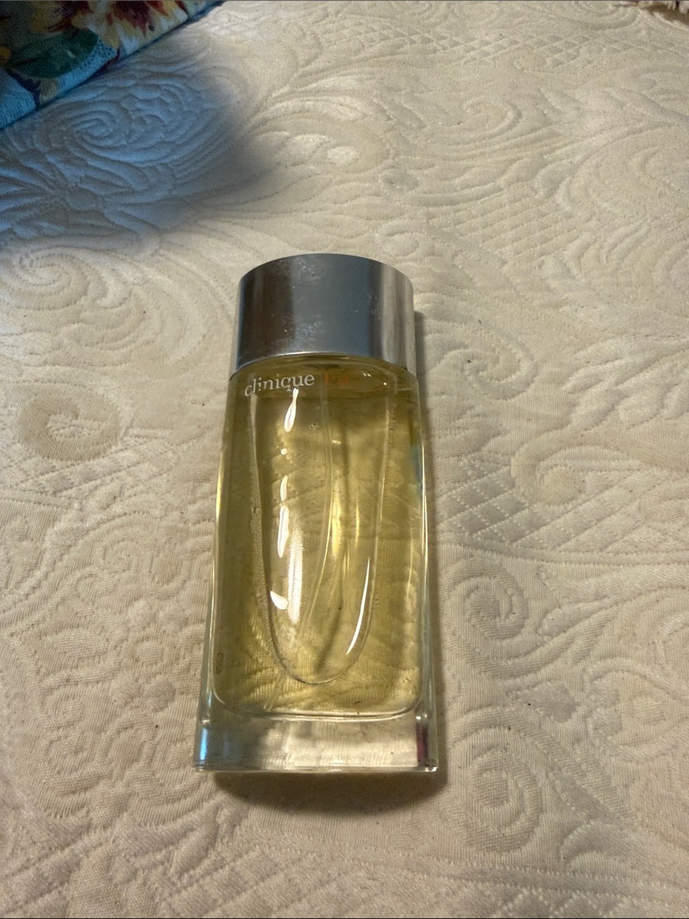 Clinique Yellow Body Oil Bottle with Silver Cap